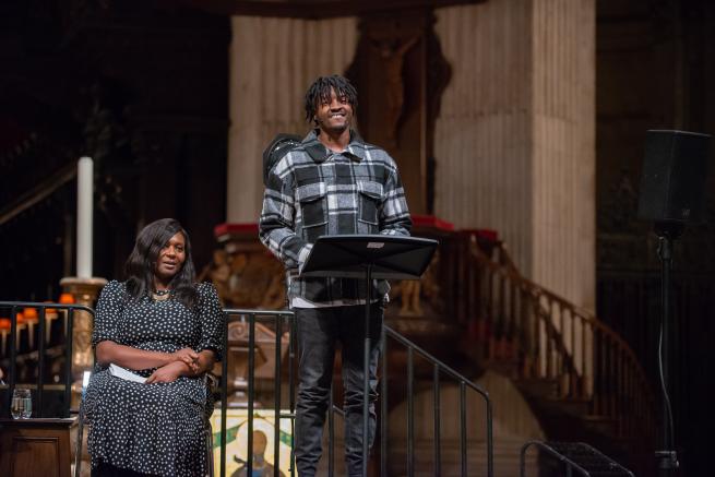 Musician Guvna B speaking at St Paul's Cathedral with Chine McDonald alongside