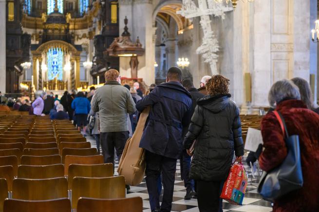 congregation entering cathedral for service