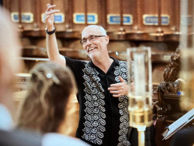 Patrick Craig conducting a choir