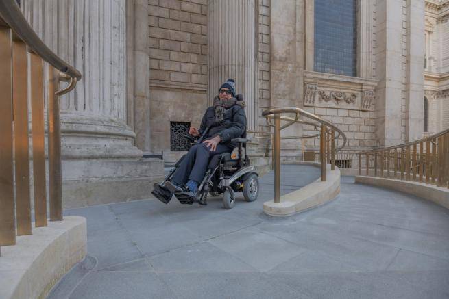 Visitor using the ramp at the Equal Access entrance