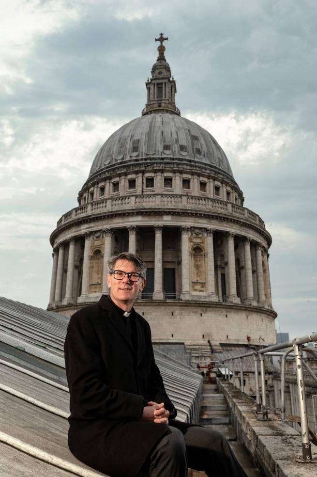 Dean of St Paul's, Andrew Tremlett sits in front of the Dome of the Cathedral