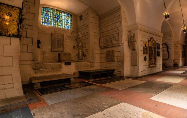 A photograph of Artists' Corner in the Crypt, with memorials on the floor and walls