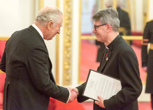 The Dean of St Paul's Cathedral, the Very Reverend Andrew Tremlett, shakes hands with HM King Charles III
