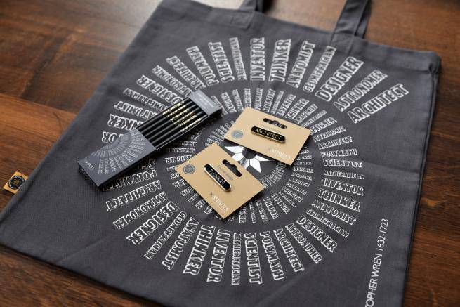 A cotton tote bag, set of 6 pencils and two metal and enamel badges