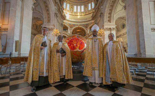 The Dean of St Paul's Cathedral with Diocese of London clergy beside the artwork, Tributaries of Knowledge, by Bryony Benge-Abbott