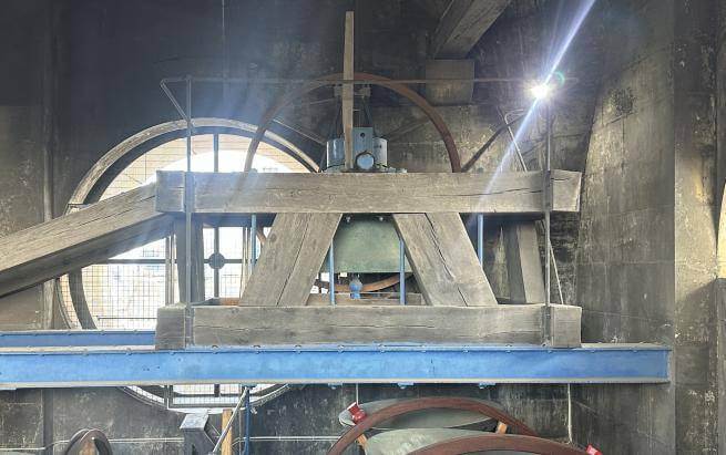 The huge service bell sits in its wooden surrounds in the bell tower