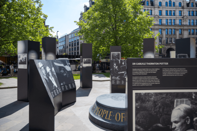 A close up shot of the exhibition, with the war memorial visible in the centre of the exhibition boards.