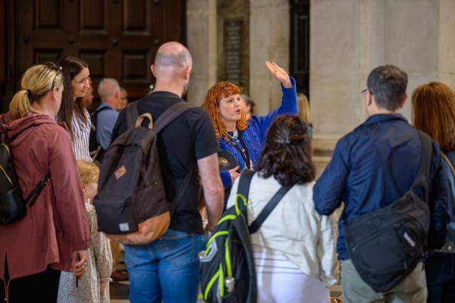 Emily, a member of the Learning team, leads a tour group.