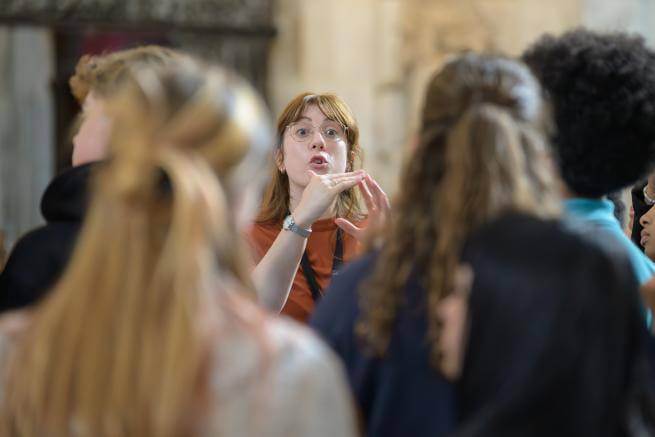 Emma, a member of the Learning team, speaks to visitors on a tour.