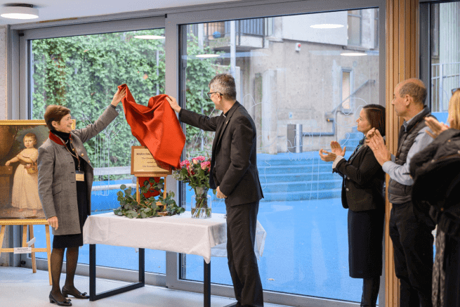 The Dean and the Head of St Paul's Cathedral School unveil the plaque for the new girls' boarding house.