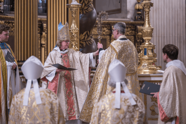 Bishop Sarah hands her crozier back to the Dean.