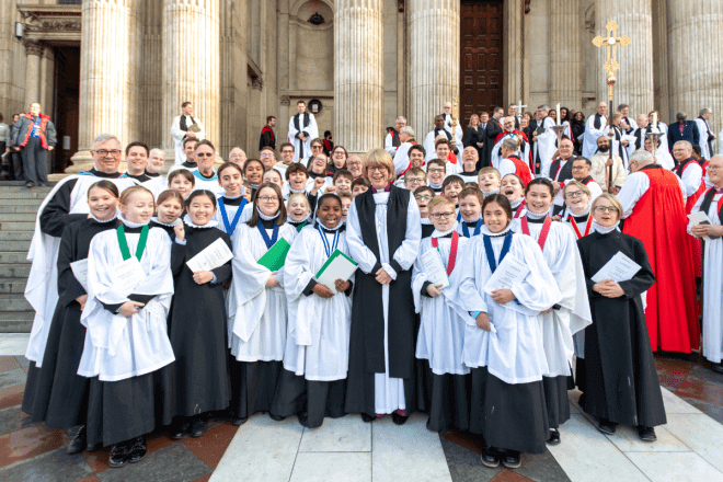 Archbishop Sarah stands with the Choristers on the West Steps.