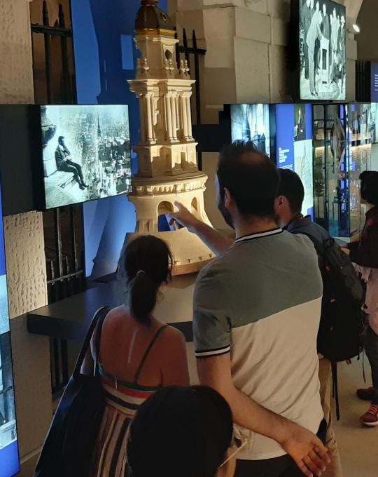 People viewing the Great Restoration exhibition in the Crypt