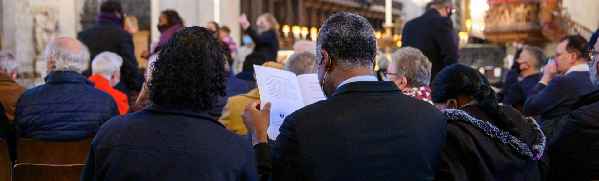 couple reading service schedule during consecration service