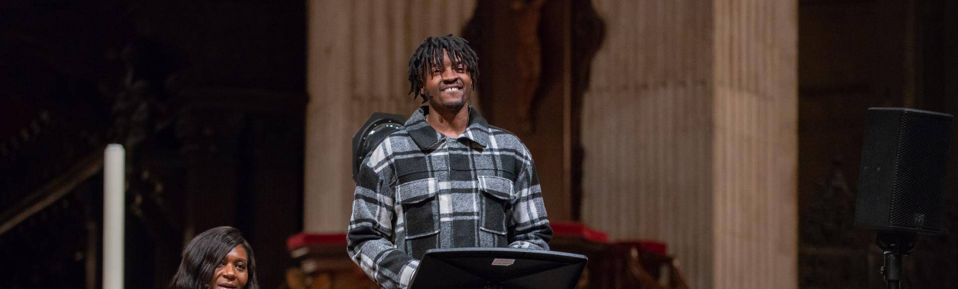 Musician Guvna B speaking at St Paul's Cathedral with Chine McDonald alongside