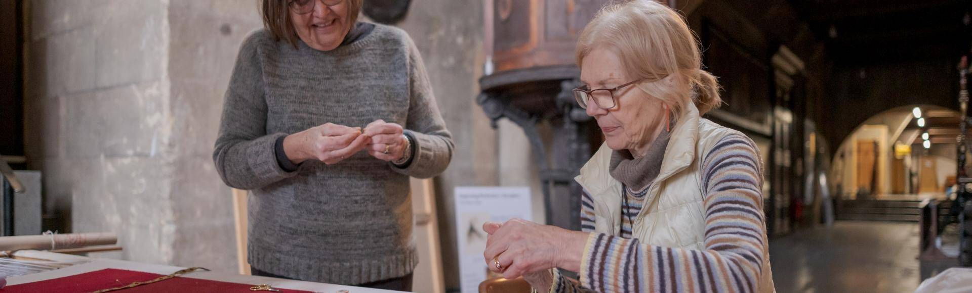 volunteer broderers smiling together