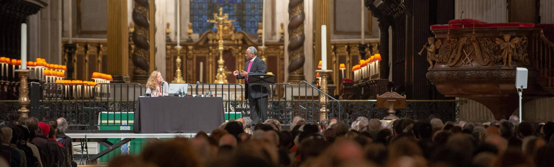 Bishop Curry and Paula Gooder on stage at an Adult Learning event in the cathedral