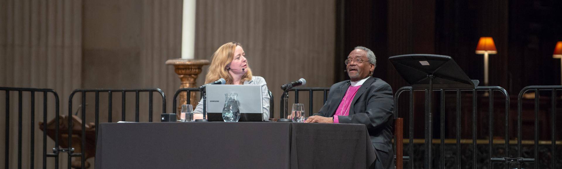 Paula Gooder and Bishop Michael Curry talk to each other on stage at St Paul's Cathedral