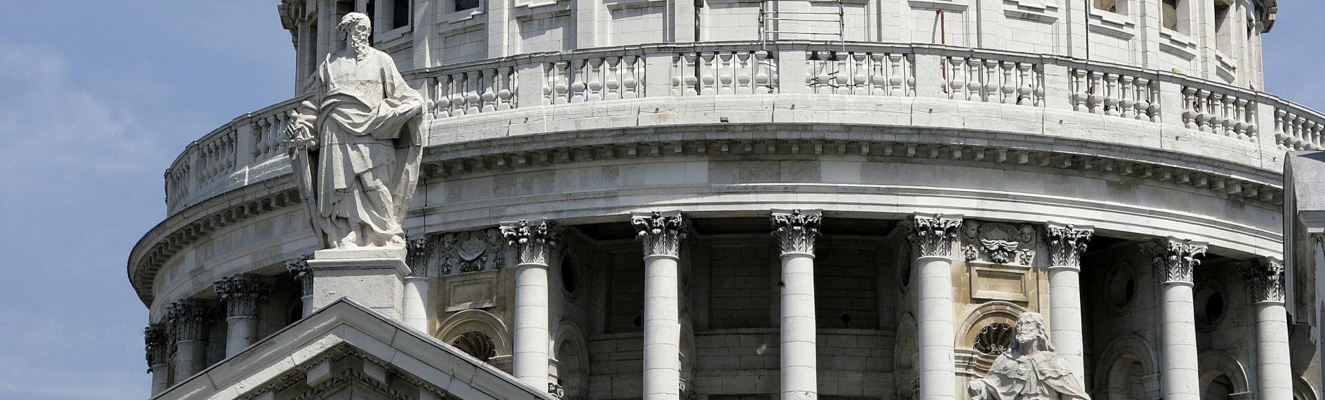 Statue of St Paul alongside the dome of the cathedral