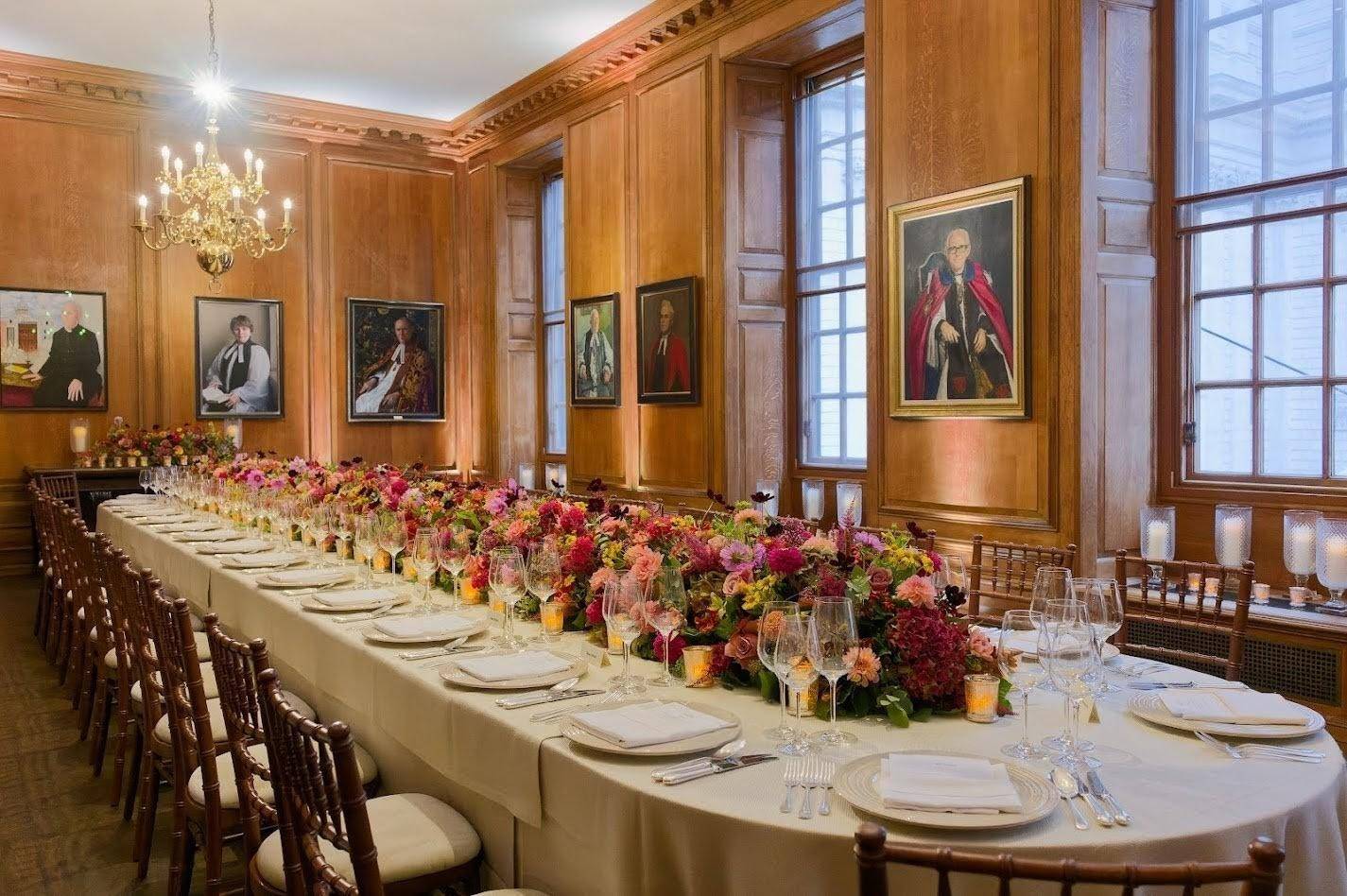 Chapter House lunch set up oblong table with flowers in the centre