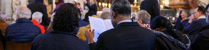 couple reading service schedule during consecration service