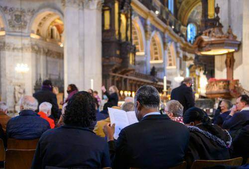 couple reading service schedule during consecration service