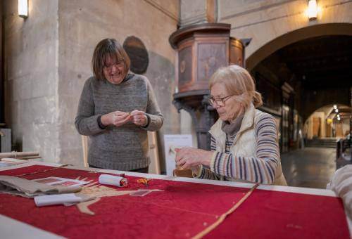 volunteer broderers smiling together