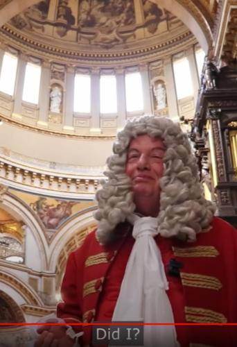 A man dressed as Sir Christopher Wren standing under the dome of St Paul's