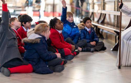 children school hands up engaged