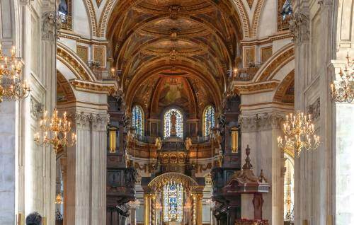 the nave with visitors and bright sunlight