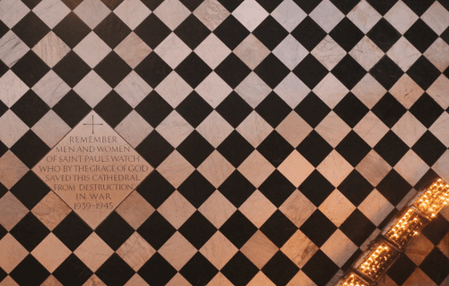 A photo of a tile in the floor of the cathedral dedicated to the St Paul's Watch