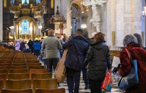 congregation entering cathedral for service