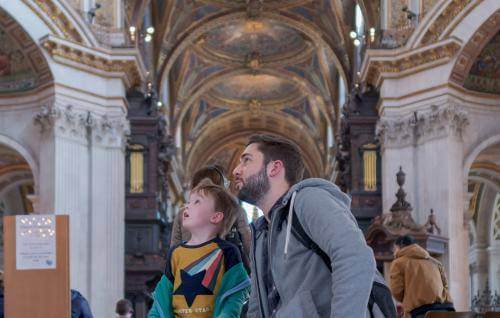 father and son in the nave looking up