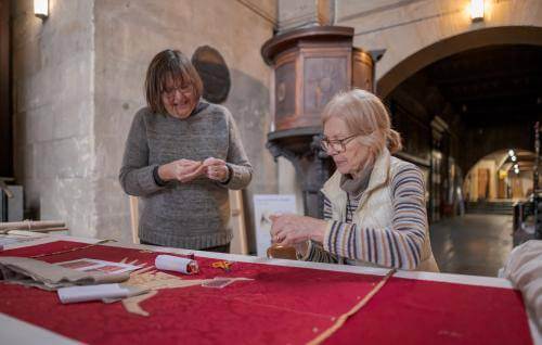 volunteer broderers smiling together