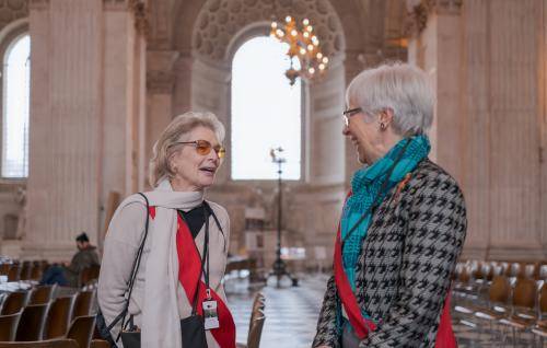 volunteer tour guides speaking on cathedral floor