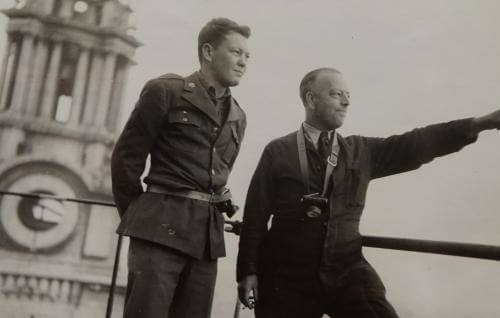 A black and white photograph of Richard Wakelin on the roof of St Paul's