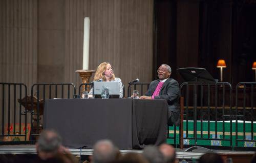 Paula Gooder and Bishop Michael Curry talk to each other on stage at St Paul's Cathedral