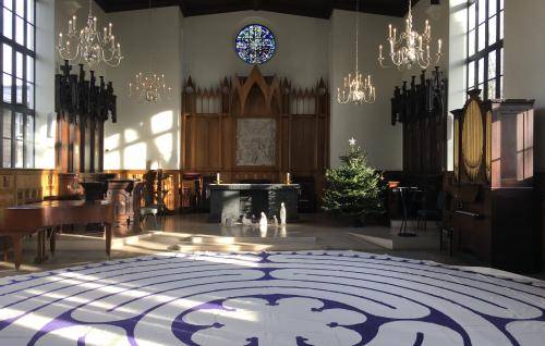 The interior of the Chapel at the Royal Foundation of St Katharine with a labyrinth laid out on the floor
