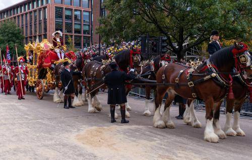The procession for the Lord Mayor's Show with horses pulling a large golden carriage