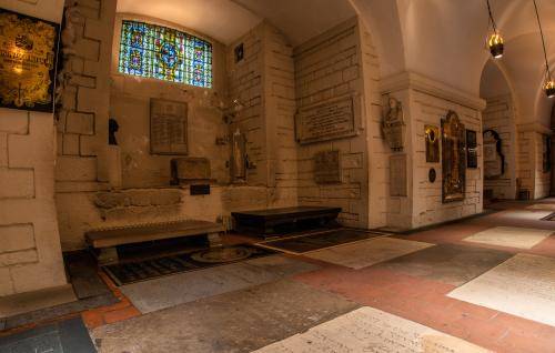 A photograph of Artists' Corner in the Crypt, with memorials on the floor and walls
