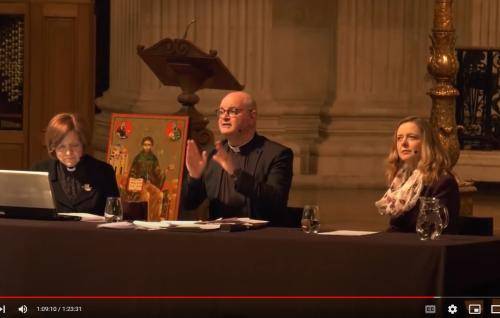 Mark Oakley and Paula Gooder speaking from a table on the dais at St Paul's.