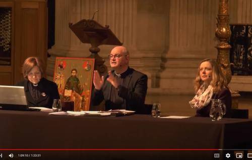 Mark Oakley and Paula Gooder speaking from a table on the dais at St Paul's.