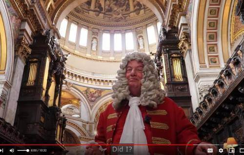 A man dressed as Sir Christopher Wren standing under the dome of St Paul's