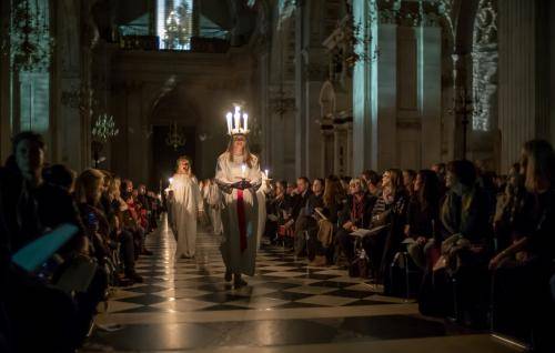 A candlelit procession for the Sankta Lucia service.