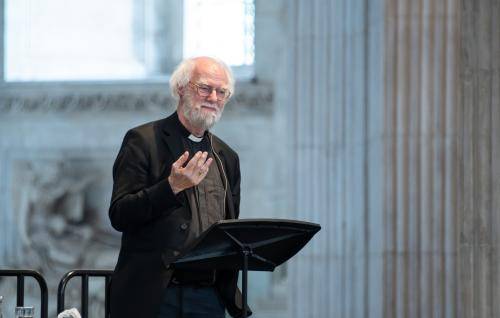 Rowan Williams stands at a lectern in St Paul's Cathedral
