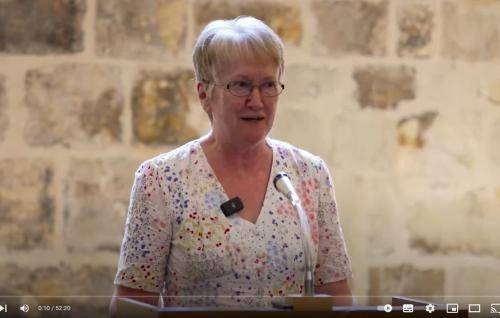 Helen stands at the lectern in the Wren Suite at St Paul's