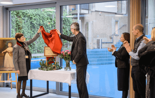 The Dean and the Head of St Paul's Cathedral School unveil the plaque for the new girls' boarding house.