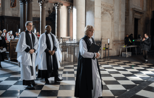 Archbishop Sarah processes followed by two bishops.