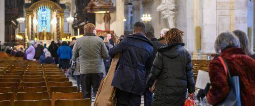 congregation entering cathedral for service