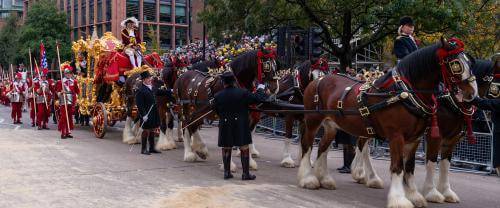 The procession for the Lord Mayor's Show with horses pulling a large golden carriage